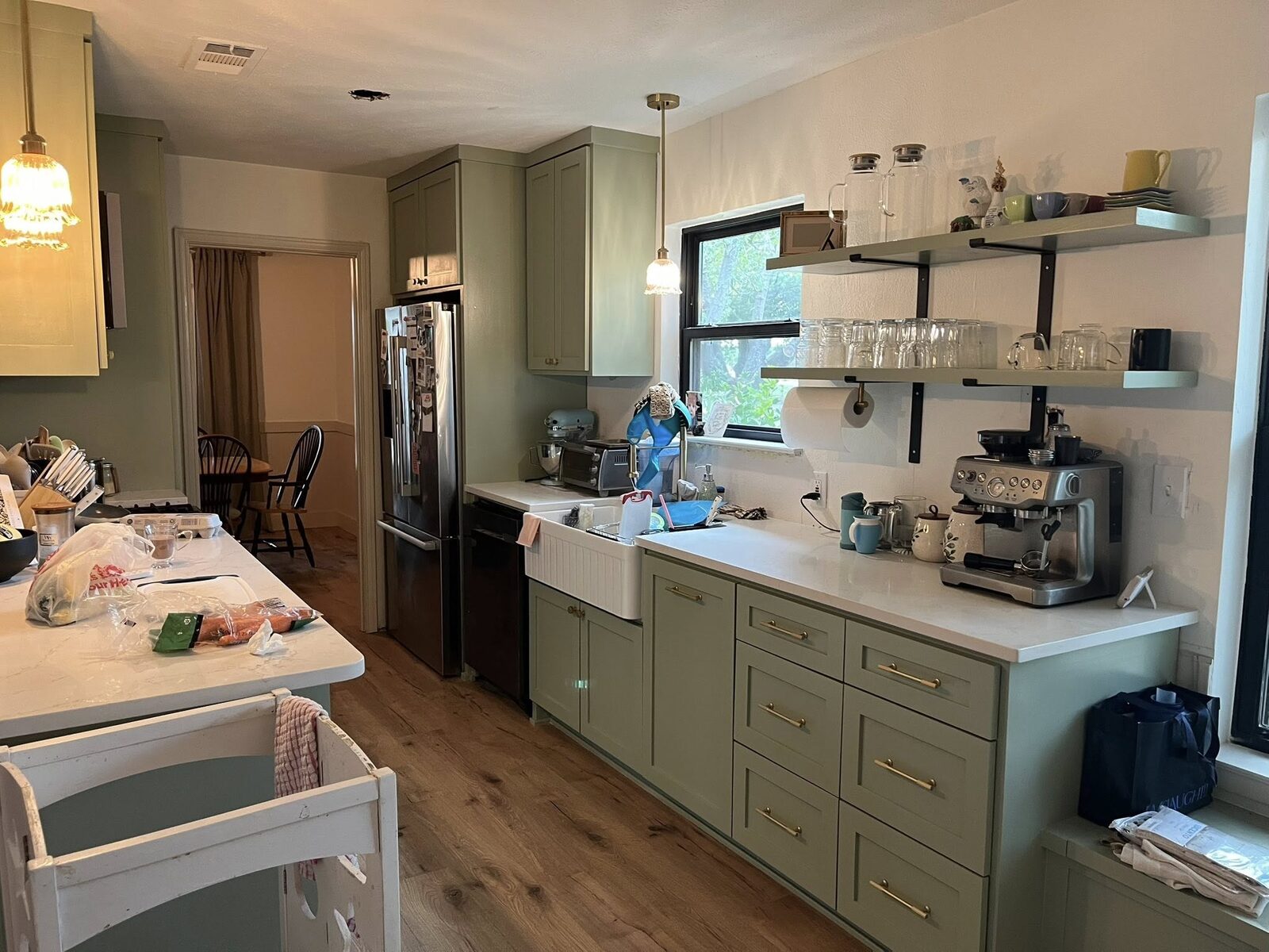 Finished sage-green kitchen remodel by Dodgen Arrows