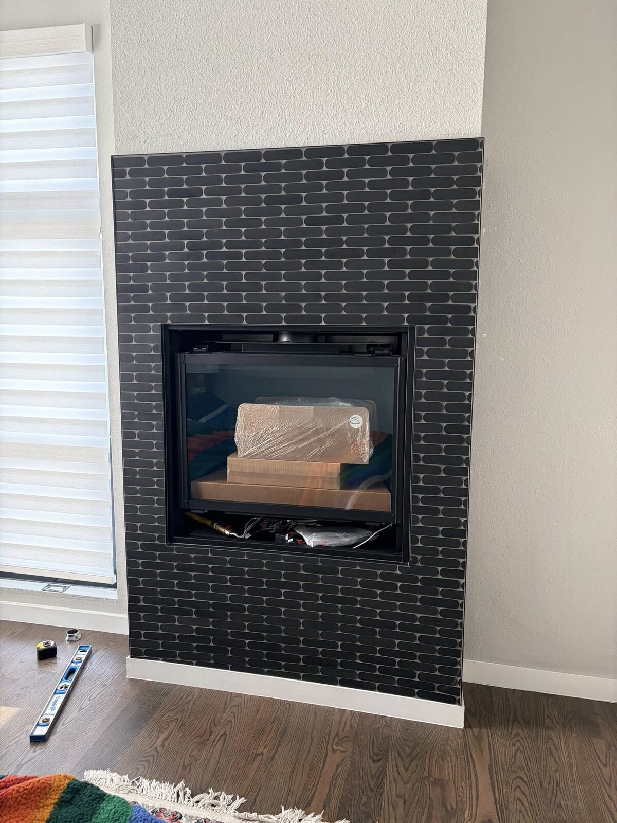Modern black tile fireplace surround