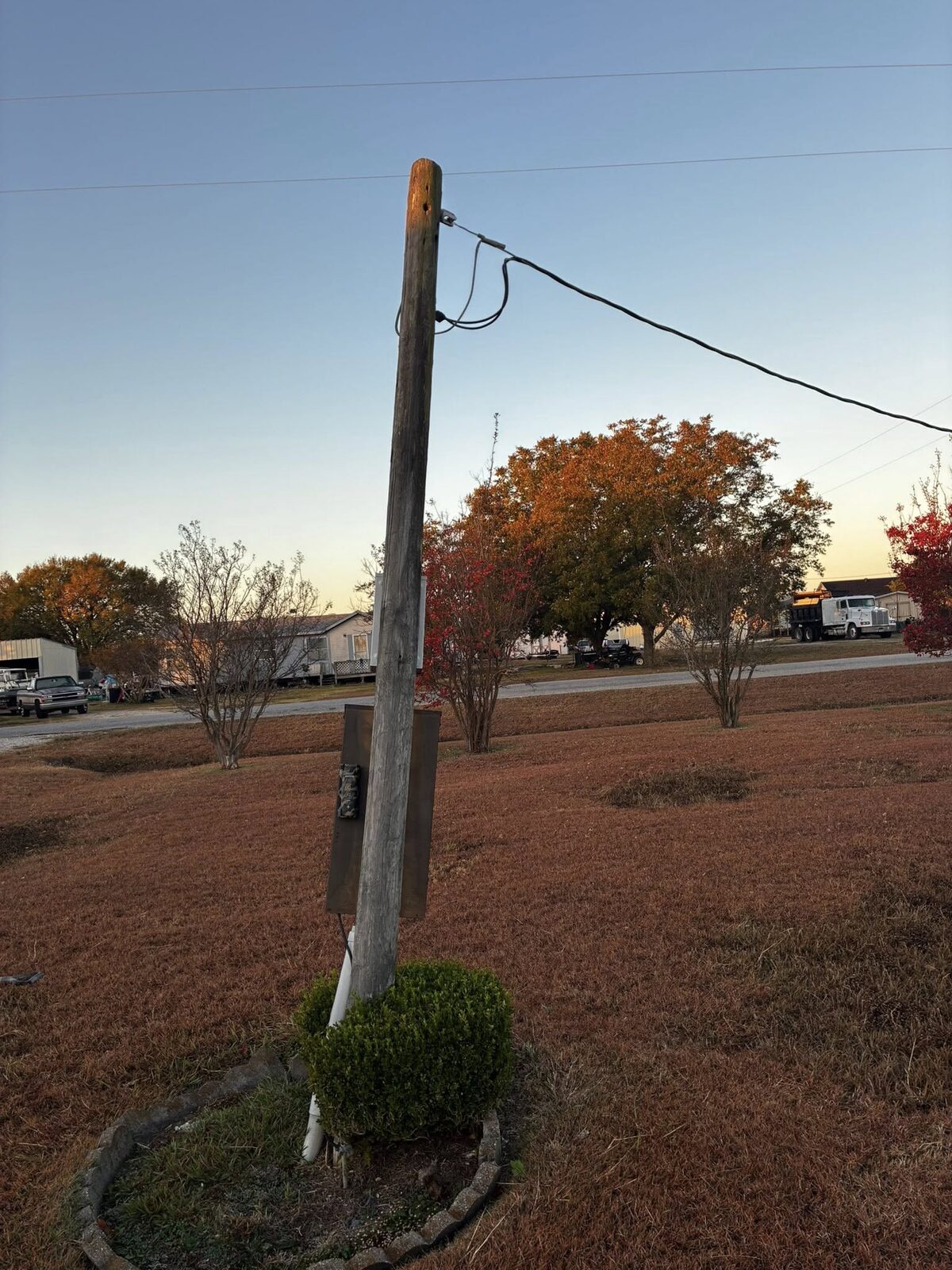 Old leaning electrical service pole